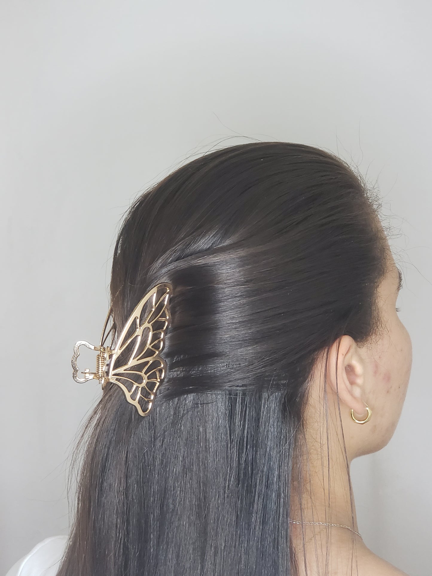 Pinza de pelo de mariposa.