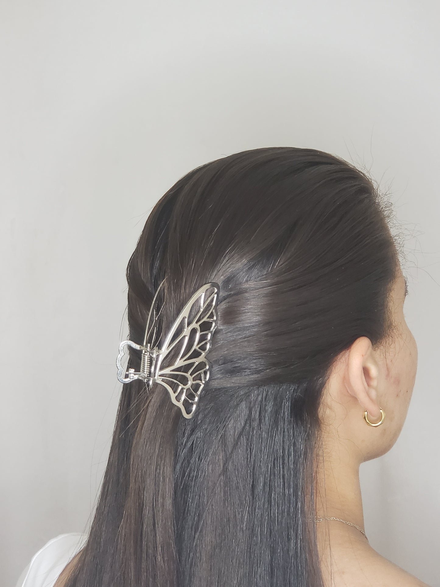 Pinza de pelo de mariposa.